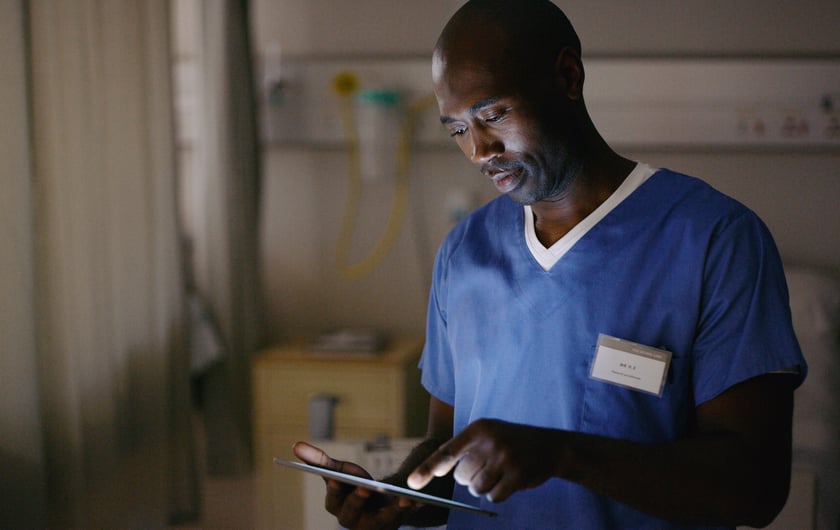 Doctor Shot of a medical practitioner using a digital tablet in a hospital ward