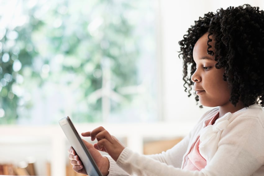Video in Education young girl using a tablet at home